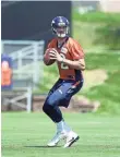  ?? RON CHENOY, USA TODAY SPORTS ?? Paxton Lynch is working on taking snaps under center.