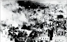  ??  ?? Mr Swaine’s photo of the smoking ruins of the city, taken from the Cathedral on June 1st 1942, the morning after the worst bombing of Canterbury in the war