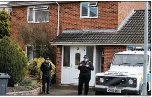  ?? AP/FRANK AUGSTEIN ?? Police stand watch outside the Salisbury, England, house of former spy Sergei Skripal, who along with his daughter collapsed Sunday outside a restaurant after being exposed to an unknown substance.
