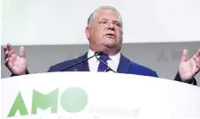  ?? JUSTIN TANG ?? Premier Doug Ford told the Associatio­n of Municipali­ties of Ontario in Ottawa on Monday he has no plans to cut more civic councils.