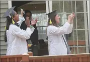  ??  ?? UMass med students stage a stay-at-home ceremony.