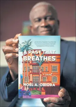  ??  ?? Obiora’s legal mystery novel, “A Past That Breathes,” is set in 1990s-era Los Angeles, where he lived for 10 years while privately practicing law.