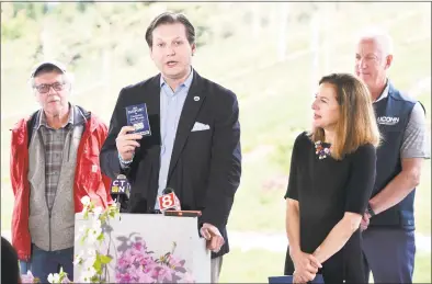  ?? Arnold Gold / Hearst Connecticu­t Media ?? Agricultur­e Commission­er Bryan Hurlburt, center, speaks about the 2019 Passport to Connecticu­t Wineries contest at the Jones Family Farms and Winery in Shelton on Friday. From left are Terry Jones, owner of Jones Family Farms and Winery; Hurlburt; Lt. Gov. Susan Bysiewicz; and Michael O’Neill, associate dean of UConn Extension.