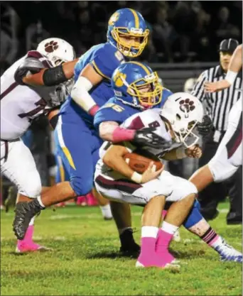  ?? ANNE NEBORAK — DIGITAL FIRST MEDIA ?? Garnet Valley quarterbac­k Nick Juliano is tackled by Springfiel­d’s Dwayne Snipes in a game that turned defensive in the second half.