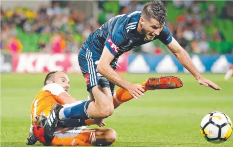  ?? Picture: SCOTT BARBOUR/GETTY ?? WIN FOR THE AGES: Victory’s Terry Antonis clashes with Roar’s Ivan Franjic at AAMI Park last night.