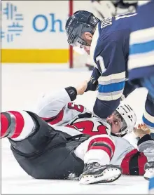  ?? [TYLER SCHANK/DISPATCH] ?? Devils left wing Brett Seney and Blue Jackets center Brandon Dubinsky, right, mix it up in the first period of the Jackets’ 2-1 win.