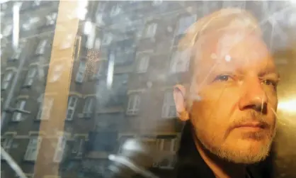  ?? Photograph: Matt Dunham/AP ?? Julian Assange is taken from court in London in May 2019.