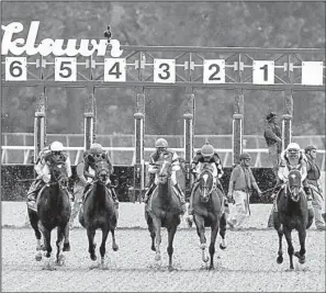  ?? Arkansas Democrat-Gazette/MITCHELL PE MASILUN ?? Horses break from the gate in Friday’s Apple Blossom Handicap. Stellar Wind (third from the right) won the race by 1¼ lengths over Terra Promessa with a time of 1:42.75 in the 1 1/16-mile race. Stellar Wind paid $2.80 to win, $2.20 to place and $2.10...