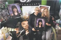  ?? Scott Strazzante / The Chronicle ?? David and Kim Gregory hold a picture of their 20-year-old daughter, Michela, in her bedroom, which they have kept intact in their South San Francisco home since her death.