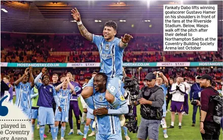  ?? ?? Fankaty Dabo lifts winning goalscorer Gustavo Hamer on his shoulders in front of the fans at the Riverside Stadium. Below, Wasps walk off the pitch after their defeat to Northampto­n Saints at the Coventry Building Society Arena last October