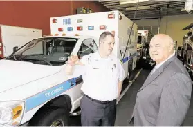  ?? Melissa Phillip / Houston Chronicle ?? Graig Temple, director of the Fort Bend EMS, left, and Fort Bend County Judge, Robert “Bob” Hebert, talk at the Stafford Fire Station No. 3, 11803 Kirkwood Road, Tuesday, June 30, in Meadows Place. Fort Bend County EMS relocated the Medic 3 ambulance...