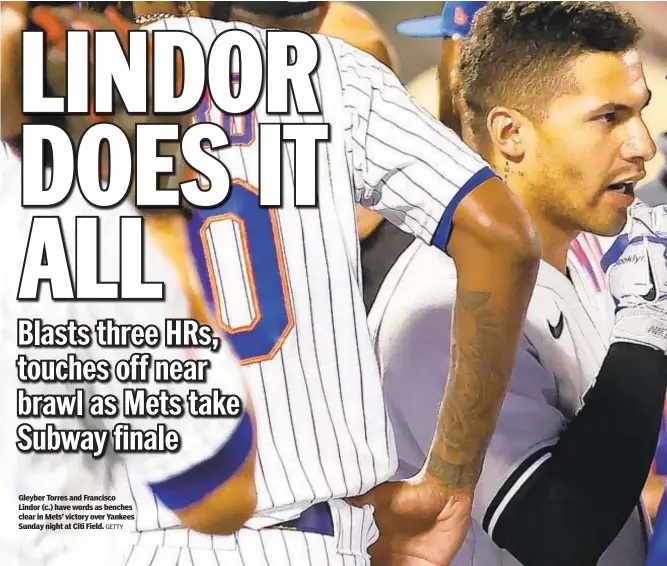  ?? GETTY ?? Gleyber Torres and Francisco Lindor (c.) have words as benches clear in Mets’ victory over Yankees Sunday night at Citi Field.