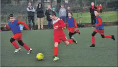  ?? 01_A03footy08 ?? Arran keep the ball with three St Cadoc’s defenders closing in.