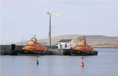  ??  ?? LIFESAVERS: RNLI Charles Lidbury and the relief lifeboat 17-31, at Aith mooring in Shetland