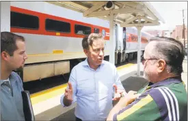  ?? Ned Gerard / Hearst Connecticu­t Media ?? Ned Lamont speaks to residents at the train station in Ansonia.