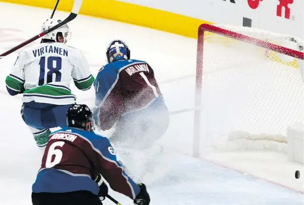  ?? — THE ASSOCIATED PRESS ?? Canucks winger Jake Virtanen scored the opening goal and added a helper in a 5-1 road win over the Avalanche Saturday.