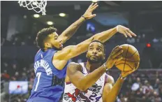  ?? ERNEST DOROSZUK ?? Raptor Norman Powell drives against the Orlando Magic’s Michael Carter-Williams at Scotiabank Arena in Toronto Monday.