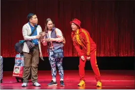  ?? COURTESY OF REED FLORES — THEATREWOR­KS SILICON VALLEY ?? Albert (Will Dao), left, and Jennifer (Jenny Nguyen Nelson) are greeted by a stranger, Tzi Chuan (Francis Jue),as they arrive in China in TheatreWor­ks Silicon Valley's “Tiger Style.”