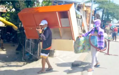  ?? PHOTOGRAPH BY AL PADILLA FOR THE DAILY TRIBUNE @tribunephl_al ?? THESE itinerant vendors carry a variety of household goods and furniture as they go around Taytay, Rizal. They may bear heavy loads, but these help them earn a living.