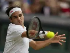 ?? Associated Press ?? Roger Federer remains alive heading into Week 2.