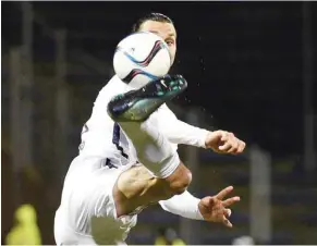  ??  ?? LORIENT: Paris Saint-Germain’s Swedish forward Zlatan Ibrahimovi­c kicks the ball during the French L1 football match Lorient against Paris Saint Germain yesterday. — AFP