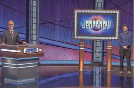  ?? FILE/JEOPARDY ?? Medina County native and Ohio State graduate Matt Amodio stands to the right of Fox Sports broadcaste­r and “Jeopardy!” guest host Joe Buck.