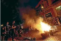  ??  ?? Anti-G20 protesters set fire to rubbish in front of the Rote Flora building in Hamburg’s Sternschan­ze district following clashes with riot police.