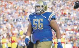  ?? Jesus Ramirez UCLA ?? ATONIO MAFI, shown playing against USC in 2018, reached his all-time recorded high of 411 pounds before fall training camp of that year. He now weighs 340.