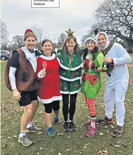  ??  ?? FANCY DRESS Andy Wingate, right, and friends at a Christmas Day Parkrun