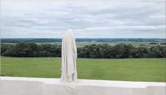  ?? LYNN HADDRALL ?? The mourning figure known as Canada Bereft dominates the landscape at Vimy Ridge on the highest point of the battlefiel­d where 3,598 Canadians died for victory in 1917.