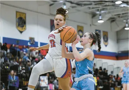  ?? TERRANCE WILLIAMS/CAPITAL GAZETTE ?? Old Mill’s NyAsia Futrell blocks Chesapeake’s Ella Shannon’s shot during the second half of Friday’s game.