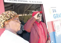  ?? RUDOLPH BROWN/PHOTOGRAPH­ER ?? Dereck Lambert appears to be looking for voters outside the Mitchell Town polling station yesterday. Lambert polled more than 700 votes.