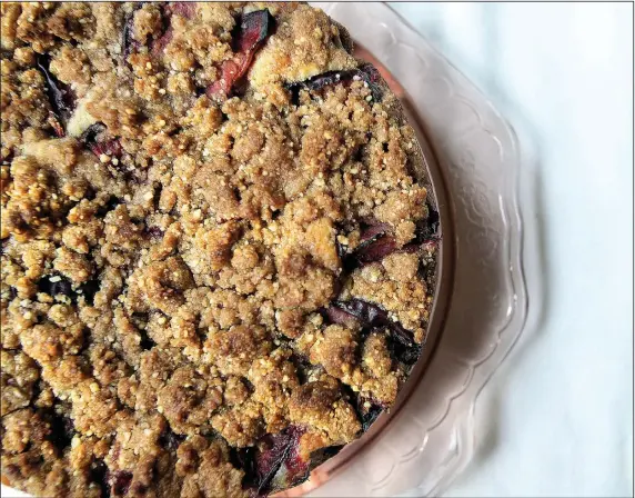  ?? Food styling/ KELLY BRANT Arkansas Democrat- Gazette/ THOMAS METTHE ?? Pflaumenku­chen, German- style plum cake, combines moist cake, fresh plums and a streusel topping.