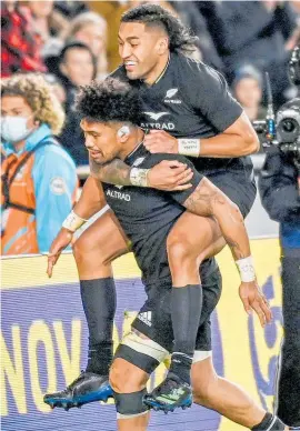  ?? Photo / AP ?? Rieko Ioane jumps on double tryscorer Ardia Savea for a piggyback after Savea’s second stunner.