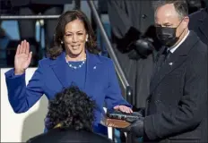  ?? POOL / GETTY IMAGES ?? Kamala harris is sworn in as vice president by Supreme Court Justice Sonia Sotomayor as her husband doug Emhoff holds the Bible Wednesday at the Capitol.