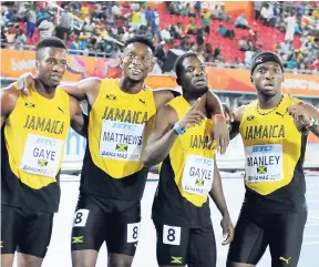  ?? FILE ?? Steven Gayle (second right) with members of the Jamaica 4x400m team at this year’s IAAF World Relays in The Bahamas. From left: Demish Gaye, Peter Matthews and Martin Manley.