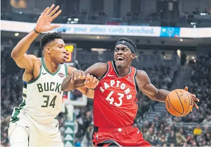  ?? MORRY GASH THE ASSOCIATED PRESS ?? Pascal Siakam, driving against Milwaukee’s Giannis Antetokoun­mpo, was limited to 16 points in the Raptors’ loss to the Bucks.