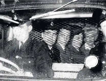  ??  ?? Ian Brady, centre, and Myra Hindley, far right, leave Chester Crown Court in a police van after the jury had retired to consider its verdict