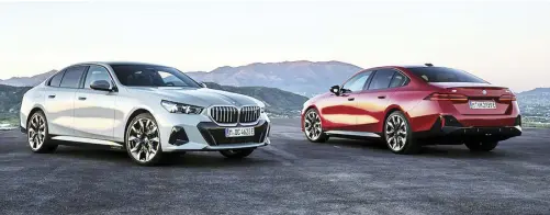  ?? ?? The fully electric BMW i5 M60 (red) and i5 eDrive40 (silver). The M60 can accelerate from 0-100 in under 4 seconds while the eDrive40 can travel up to 475 kilometers on a full charge.