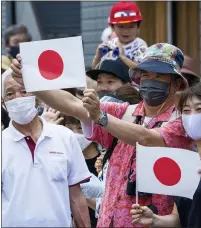  ?? FRANK GUNN — THE ASSOCIATED PRESS ?? Spectators line the course of the men’s cycling road race at the 2020Summer Olympics in Tokyo Friday. How are we to judge the pandemic-delayed Tokyo Olympics when they wrap up in two weeks? It’s a straightfo­rward question but it’s difficult to answer. That’s because there are many interests involved.