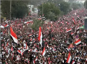  ?? (AP) ?? Followers of Shiite cleric Muqtada al-Sadr fill central Baghdad during a protest Friday.