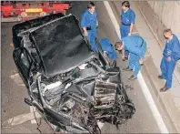  ?? AP FILE PHOTO ?? Early Sunday, Aug. 31, 1997, police services prepare to take away the car in which Britain’s Diana, Princess of Wales, died in Paris, in a car crash that also killed her boyfriend, Dodi Fayed, and the chauffeur. The crash happened shortly after...