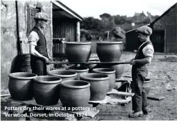  ??  ?? Potters dry their wares at a pottery in Verwood, Dorset, in October 1924