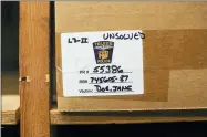  ?? ANDY MORRISON — THE BLADE VIA AP ?? Evidence from an unidentifi­ed murder victim is boxed in an evidence room at the Toledo Police Department in Toledo.