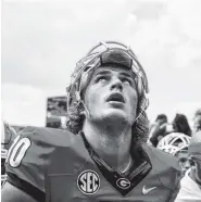  ?? JOHN PAUL VAN WERT ?? Former Georgia quarterbac­k Jacob Eason has to sit out the 2018 season at Washington due to current NCAA transfer rules, but the governing body is considerin­g making exceptions to the existing guidelines.