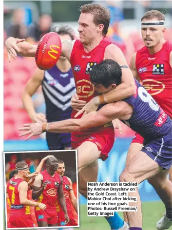  ?? ?? Noah Anderson is tackled by Andrew Brayshaw on the Gold Coast. Left: Mabior Chol after kicking one of his four goals. Photos: Russell Freeman/ Getty Images