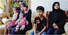  ??  ?? THE widow and children of Palestinia­n critic Nizar Banat, who, according to officials, died while being arrested by members of Palestinia­n security forces, react after hearing the news of Banat’s death in Hebron, West Bank, yesterday. Reuters