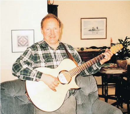  ?? — IAN HEPHER ?? Paul Hepher is shown at his brother’s home in Lethbridge, about a year before he was murdered. Hepher, an amateur musician, is playing a guitar that was gift from his nephew, Robin.