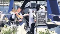  ??  ?? VENUE The couple’s wedding ceremony took place on board Alan’s yacht Marise and they signed the register below deck