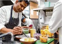  ?? ?? Executive chef Srijith Gopinathan puts the final touches on rasam poori at Copra.